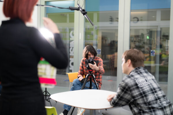 camera man shooting an interview