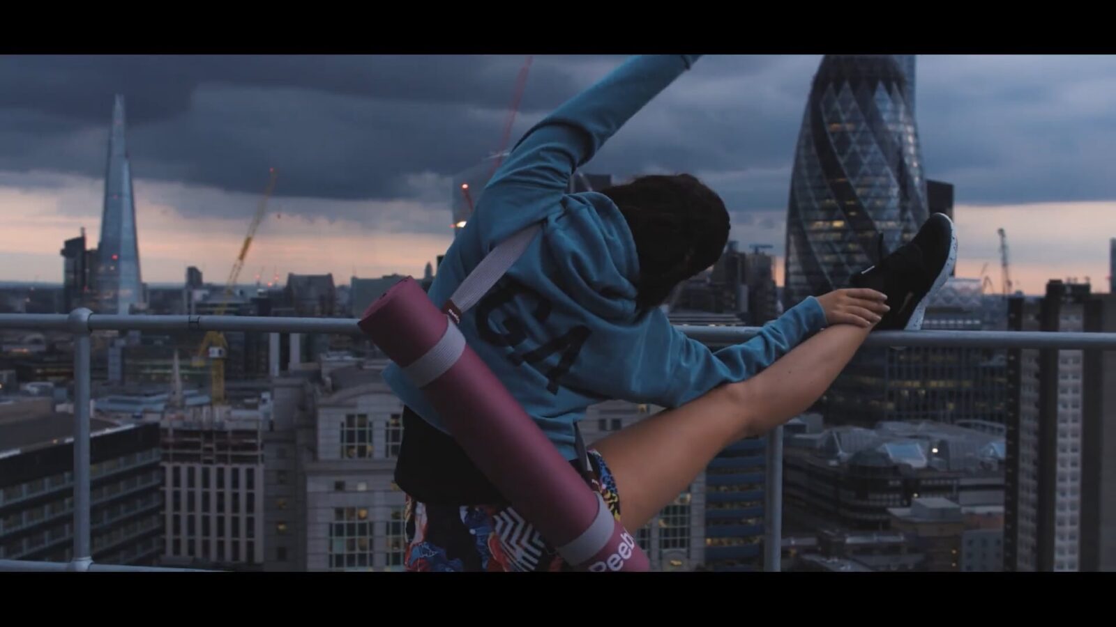 woman stretching reebok yoga