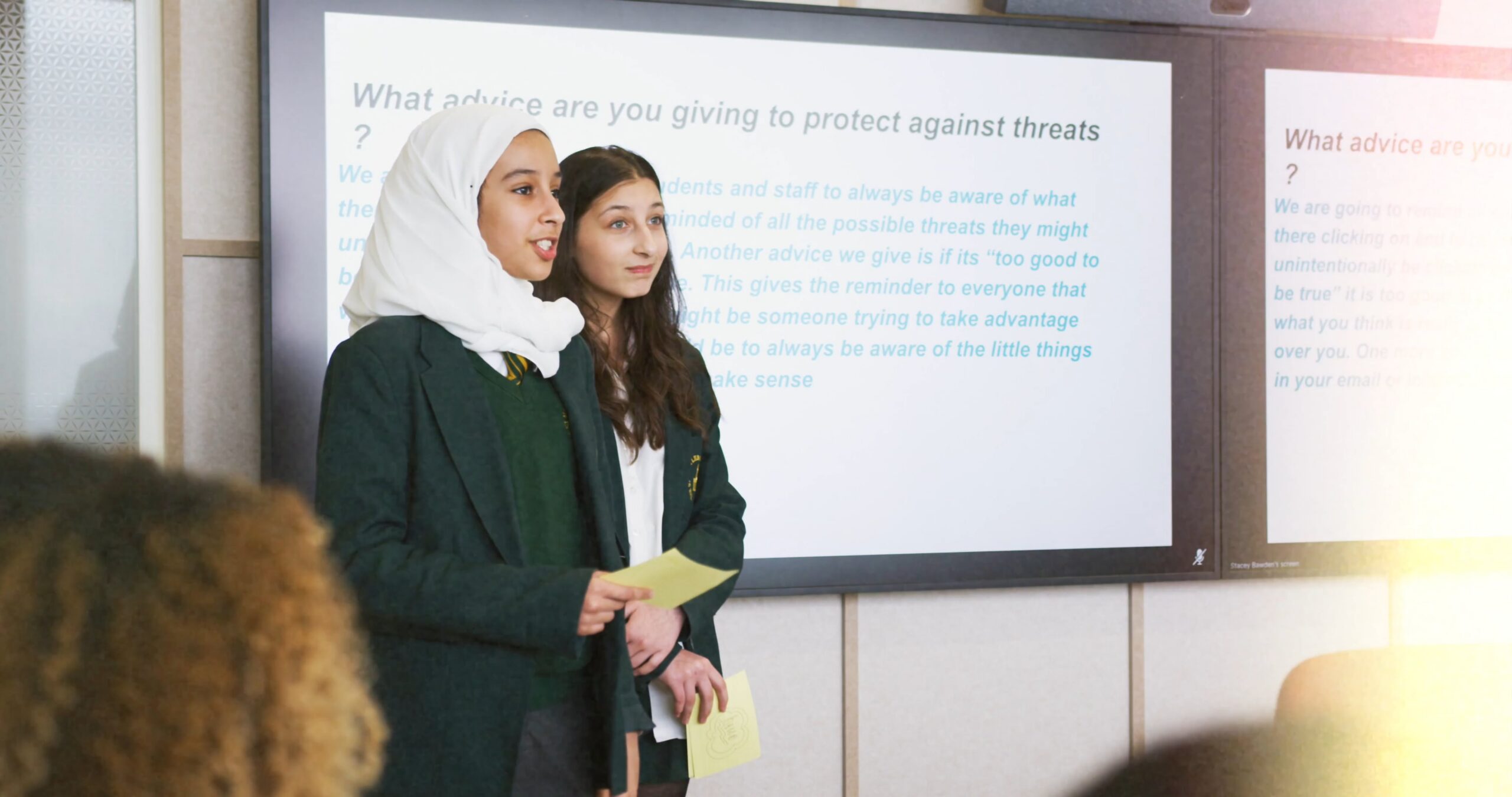 two girls giving a presentation